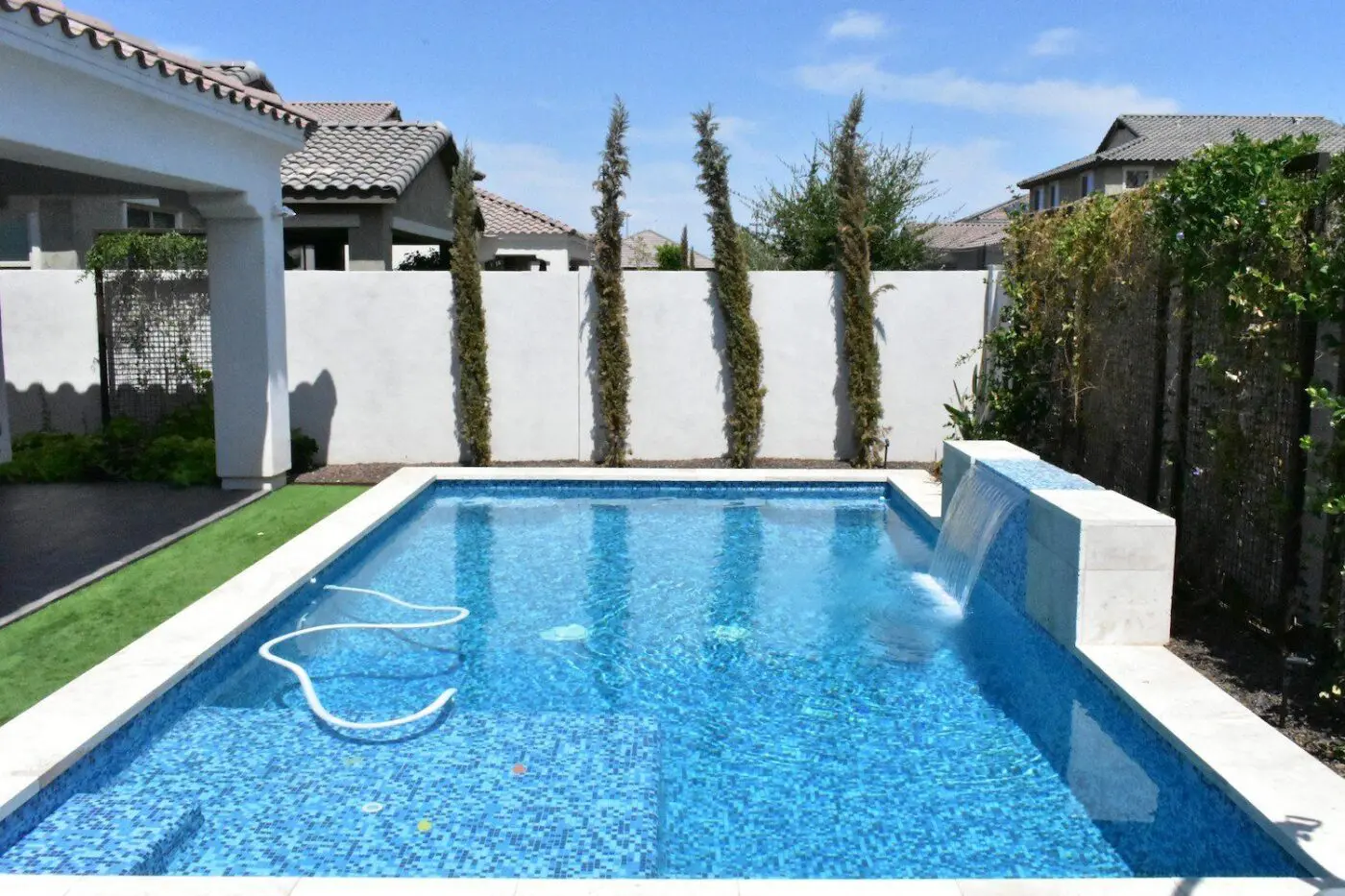 kids can rest and roll over this artificial grass pool surround after a tiring swim day